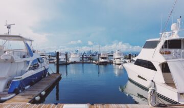 white boat on dock during daytime