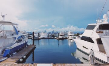 white boat on dock during daytime