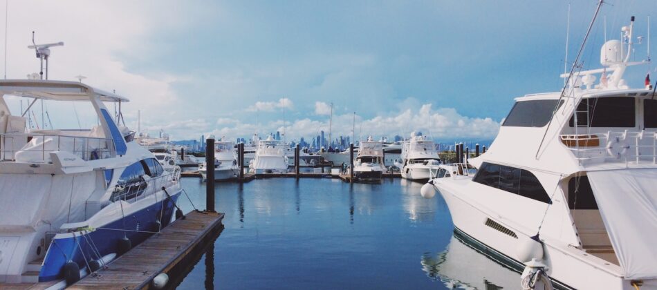 white boat on dock during daytime